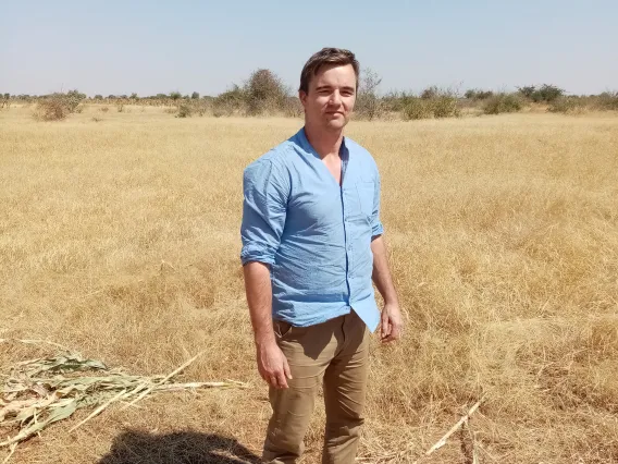 Joona Mikkola standing in African scrubland