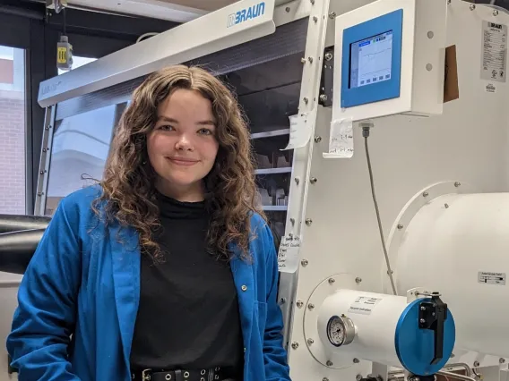 Brianna Billingsley standing in a lab.