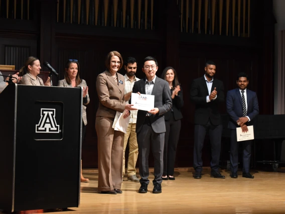 Photo of Dean Kirsten Limesand and Beihua Guo at the Grad Slam 2025 Final Round and Award Ceremony. 