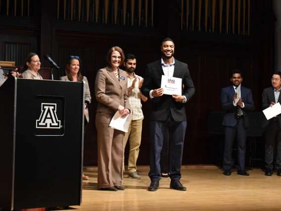 Photo of Dean Kirsten Limesand and Mourad Abdennebi at the Grad Slam 2025 Final Round and Award Ceremony. 