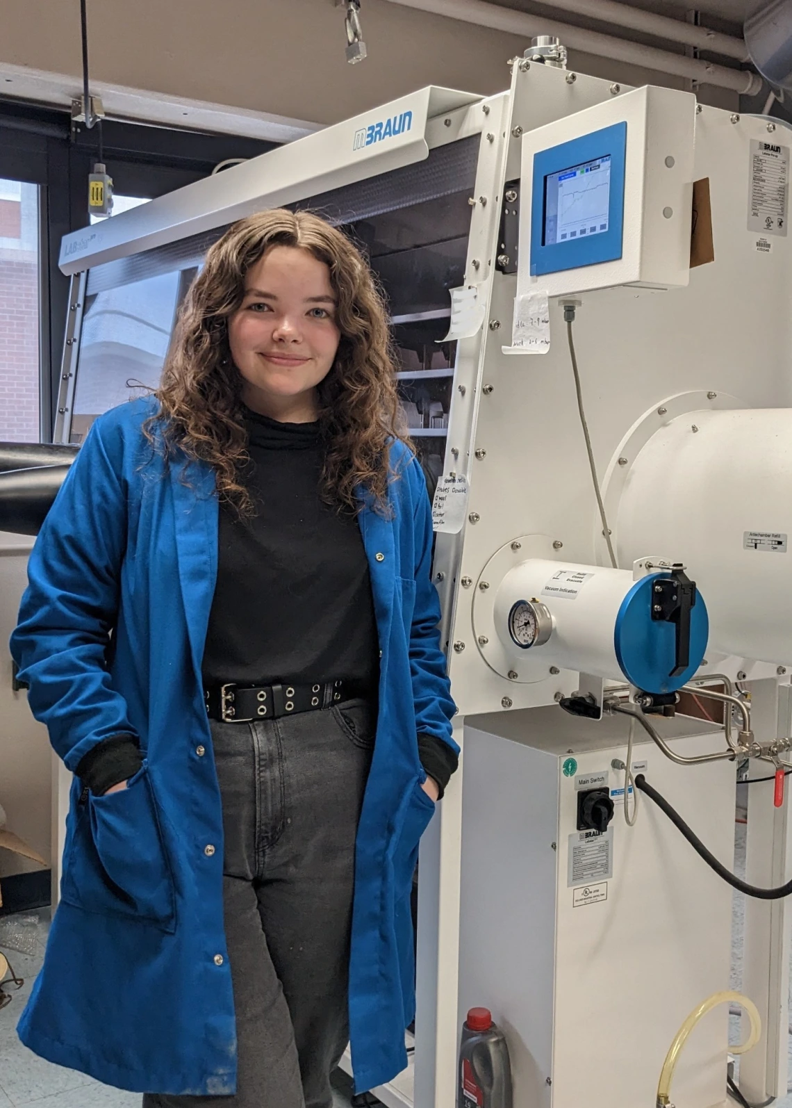 Brianna Billingsley standing in a lab.