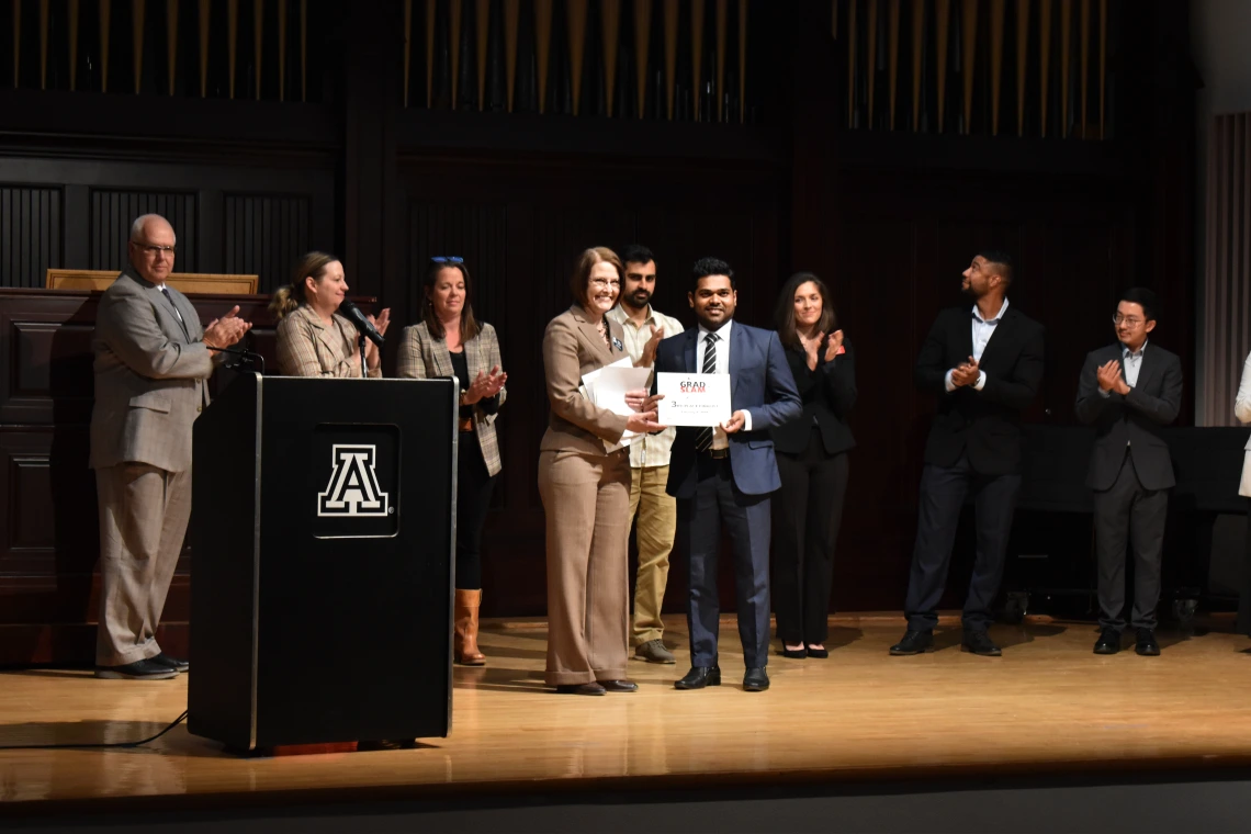 Photo of Dean Kirsten Limesand and Mudith Weerabaddanage at the Grad Slam 2025 Final Round and Award Ceremony. 