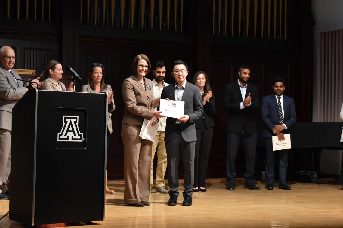 Photo of Dean Kirsten Limesand and Beihua Guo at the Grad Slam 2025 Final Round and Award Ceremony. 