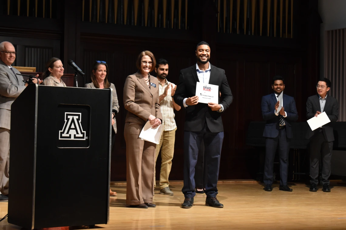 Photo of Dean Kirsten Limesand and Mourad Abdennebi at the Grad Slam 2025 Final Round and Award Ceremony. 