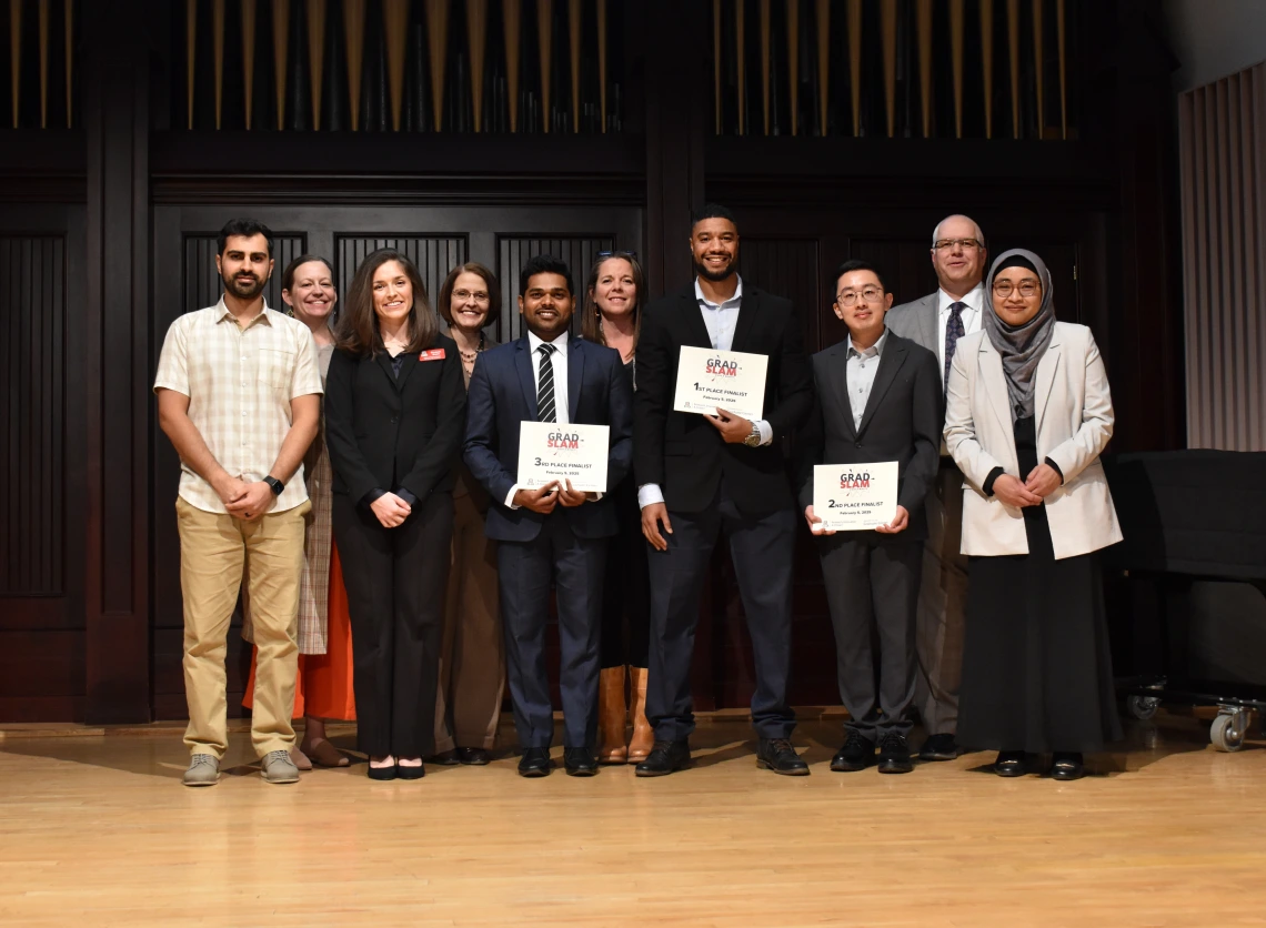 Photo of Grad Slam 2025 Finalists and Judges, and Emcee Dean Limesand. 