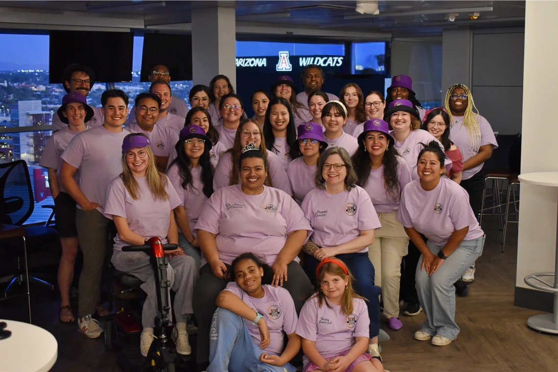 Spring 2025 Cohort poses in their Grad CAFE shirts