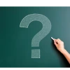 question mark drawn in chalk on a green chalkboard