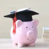 Image of a piggy bank with a graduation cap on.